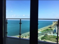 In Batumi in a new boulevard for sale apartment renovated with furniture overlooking the sea. Photo 1