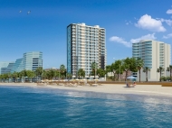 House by the sea on New boulevard in Batumi. Apartments in a new residential building by the sea on Lech and Maria Kaczynski St., center of Batumi, Georgia. Photo 1