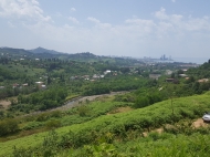 Ground area (A plot of land) for sale in a quiet district of Batumi, Georgia. Land parcel with sea view and the city. Photo 1