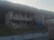 House by the river in Ananuri, Georgia. Photo 11