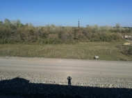 Ground area ( A plot of land ) for sale in Kutaisi, Georgia. Next to busy highway. Photo 1